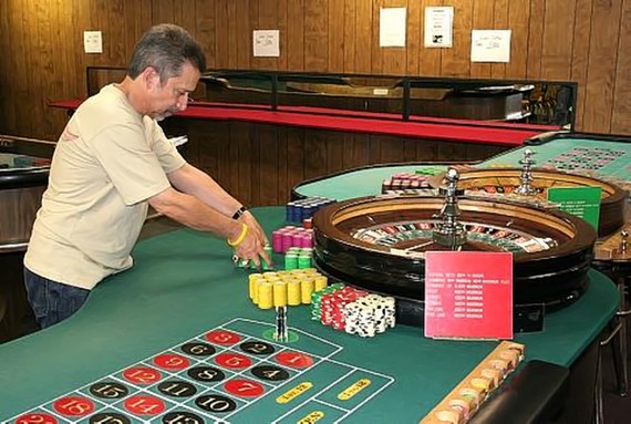 Nick prepares the roulette tables for the first class of the day